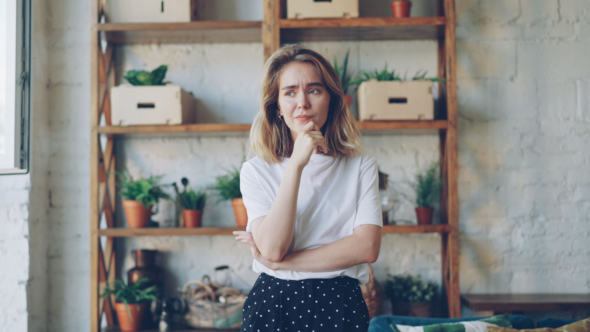 thoughtful woman in modern indoor setting